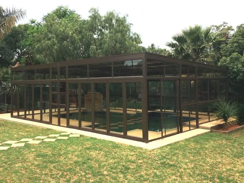 Black-framed glass conservatory with folding doors