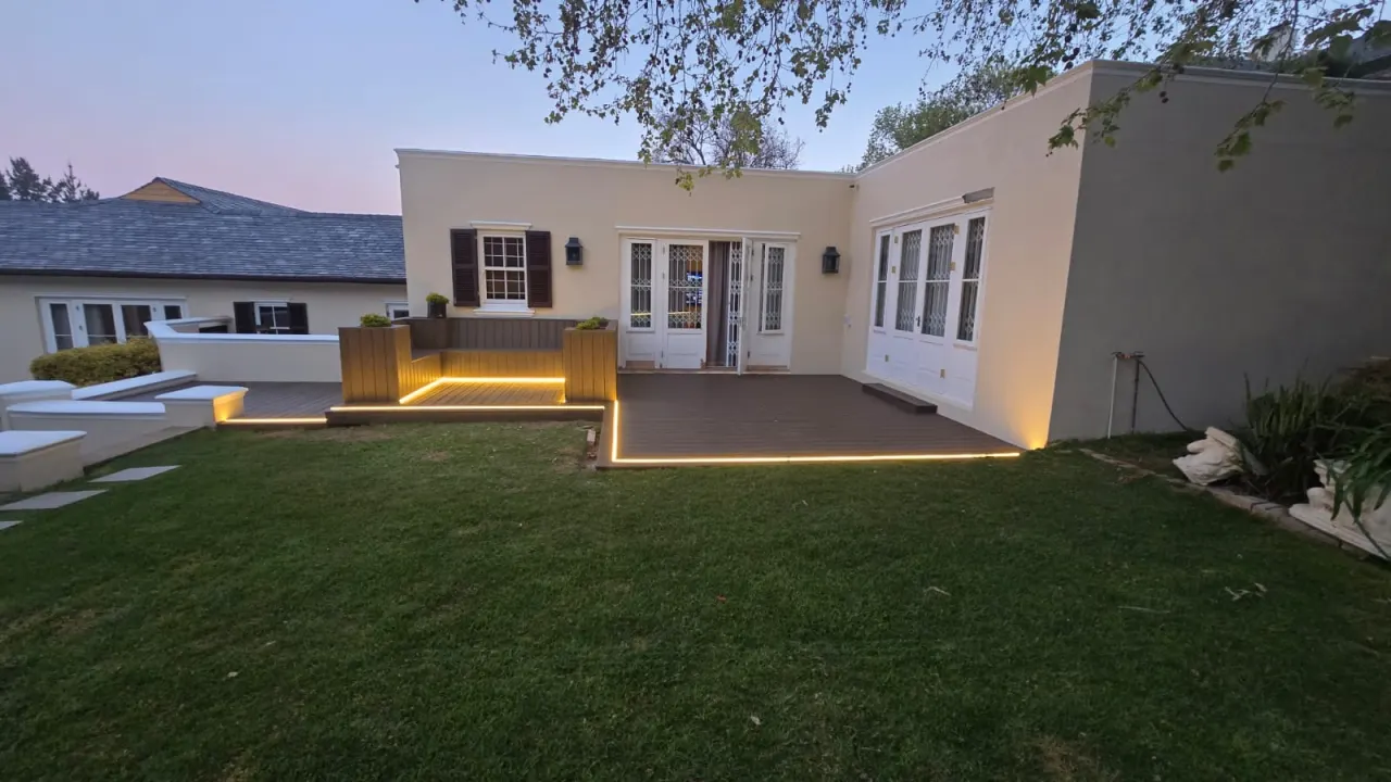 The fire pit deck at dusk with recessed edge lighting