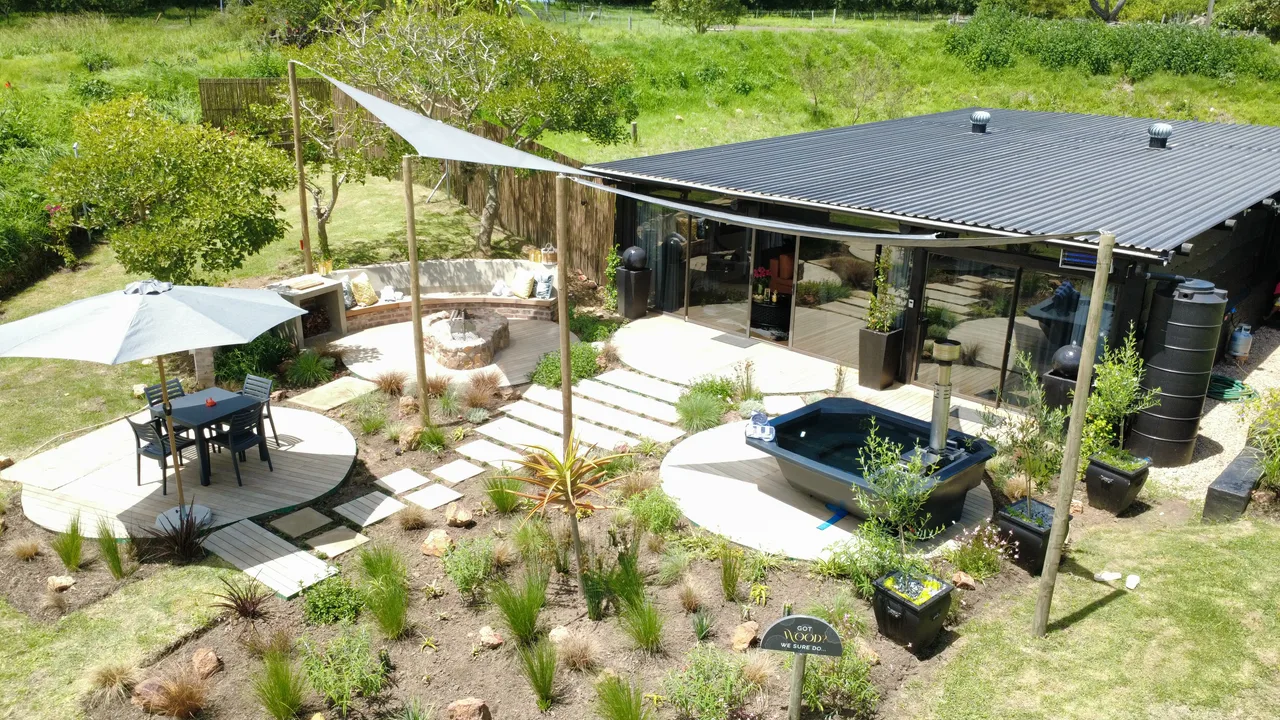 Garden suite — Aerial view of the garden suite with a shade sail over the deck seating and hot tub
