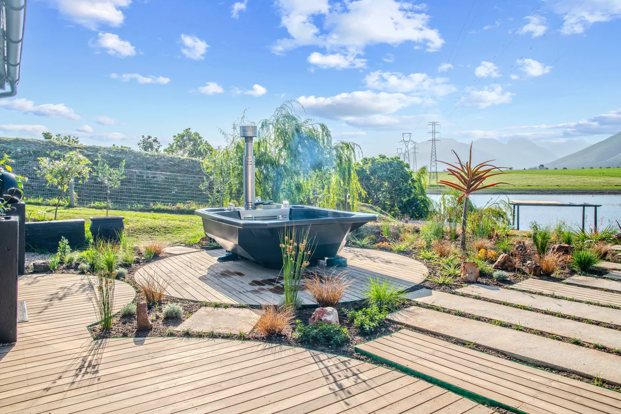 Garden suite — Hot tub deck and landscaped garden at the garden suite