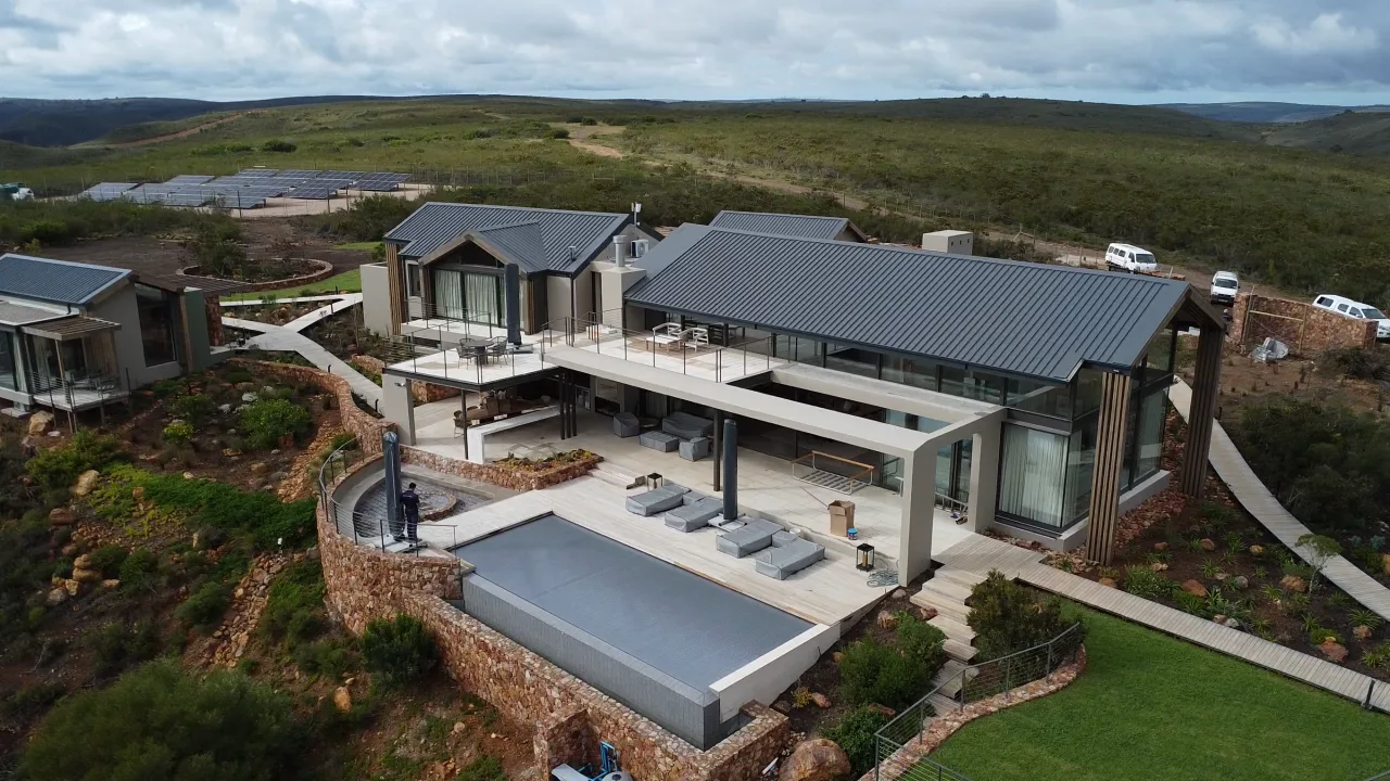 The finished Gondwana lodge, its pool deck and lawn, from the air
