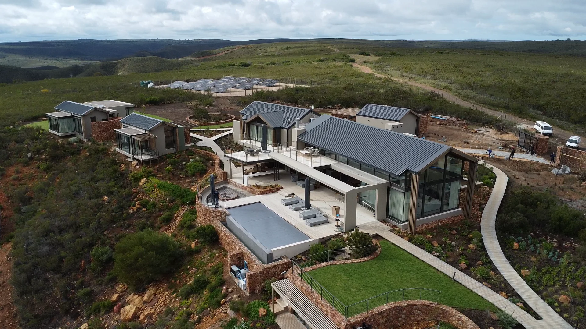 Aerial view of the Gondwana lodge, its pool and glass pavilion above the valley