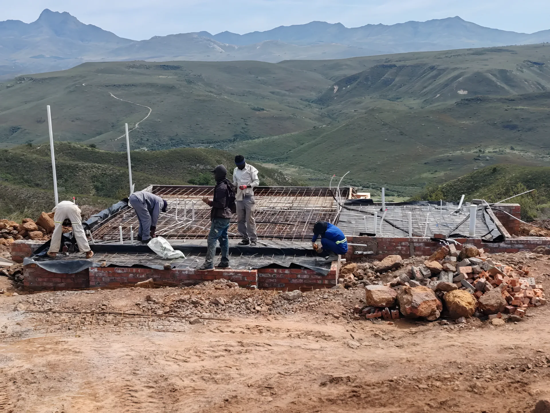 Crew preparing reinforcement for a concrete slab on site
