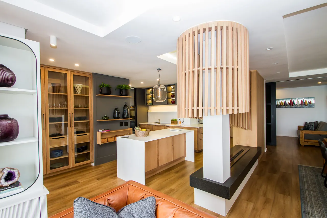 Curved timber-slat joinery wrapping a kitchen island