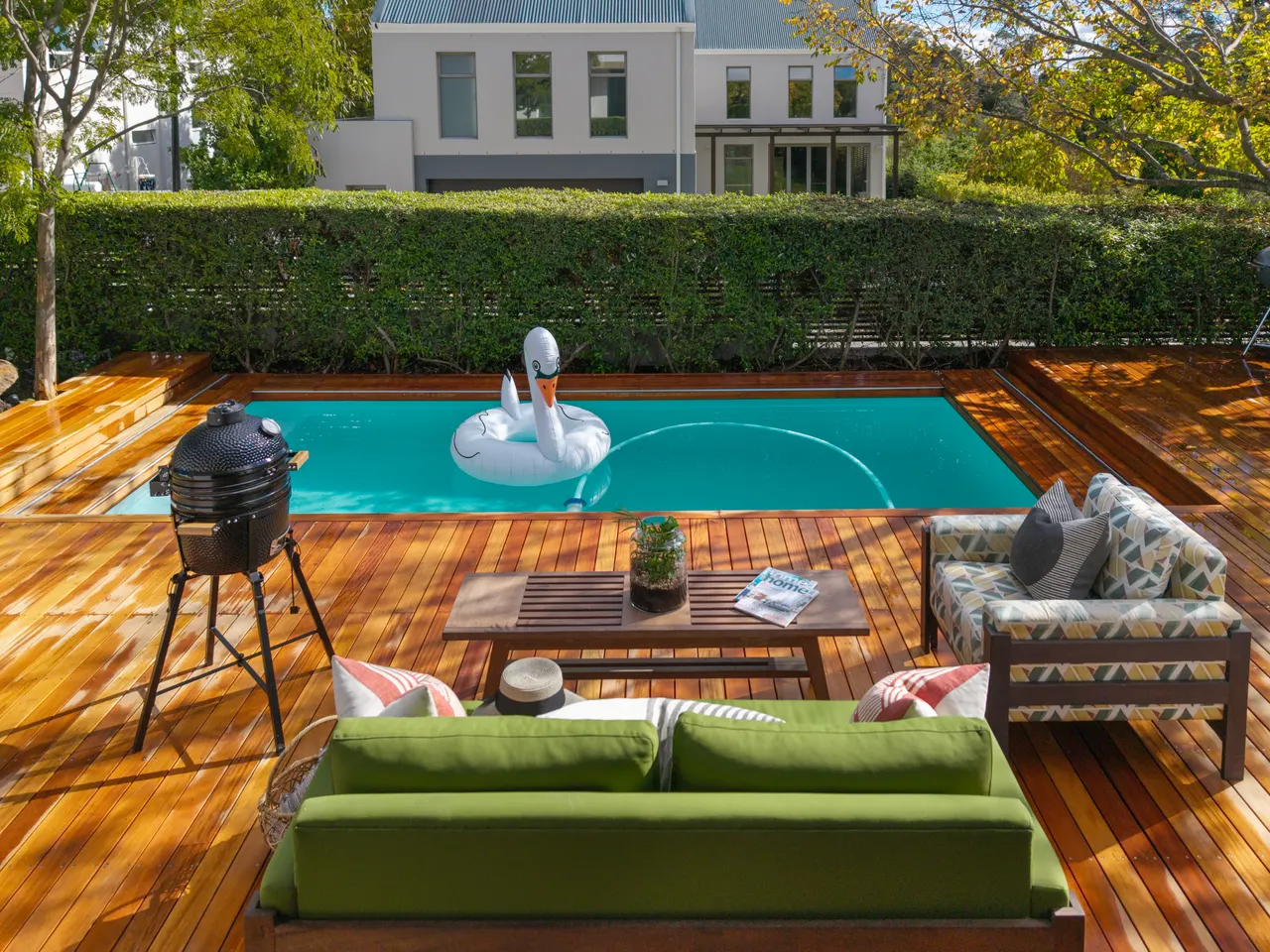 Top-down view of the deck and pool with lounge seating